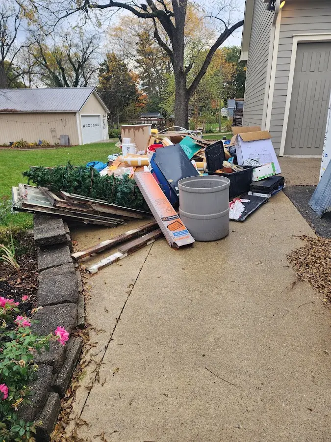 Dumpster being loaded with debris for Residential Dumpster Rental in Vero Lake Estates